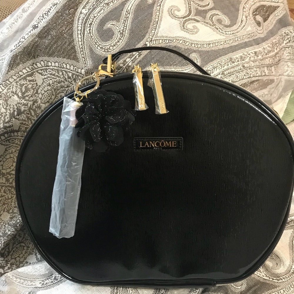Brand New Lancôme black shiny travel makeup case.